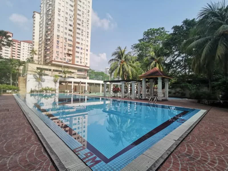 Exterior type: swimming pool deck; features: infinity pool, pool deck with loungers, surrounded by palm trees, landscaped garden, paved walkway, covered pavilion with traditional roof, high-rise condominium in background, clear blue sky; style: modern.