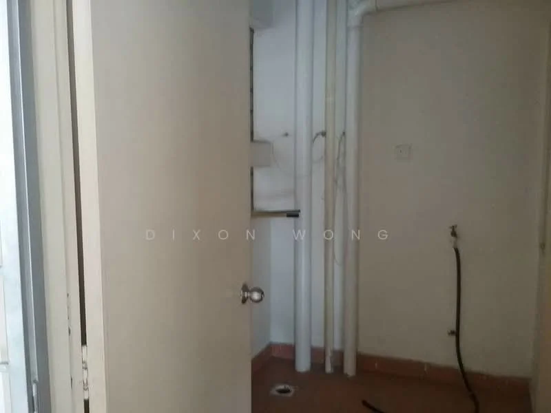 Room features: plain white walls, flooring in beige tiles, single door, exposed plumbing pipes, drainage outlet on floor, wall-mounted electrical outlet.