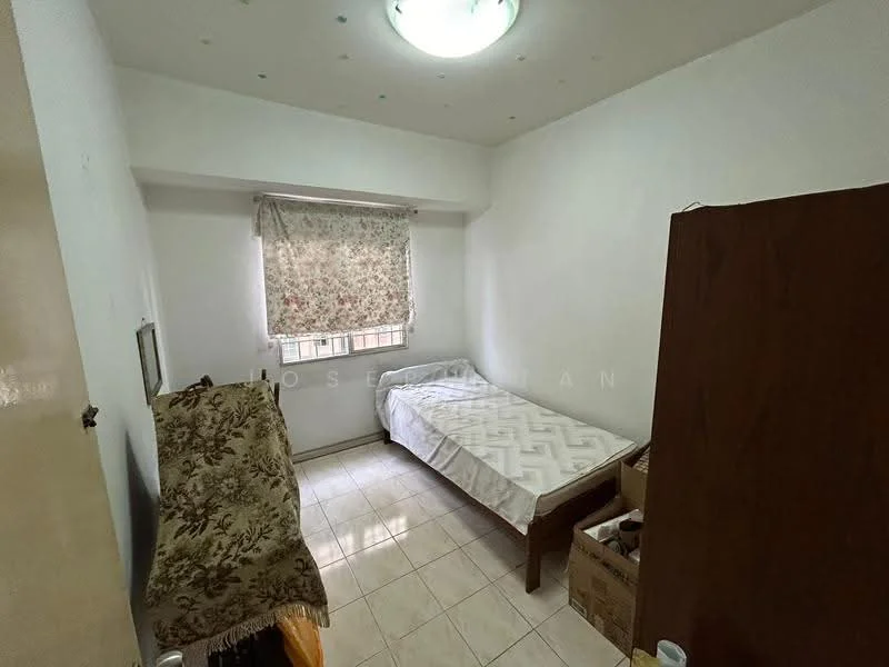 Bedroom features: single bed, white painted walls, tile flooring, curtains with floral pattern, ceiling light fixture, wooden wardrobe, decorative throw, window with view to outside.