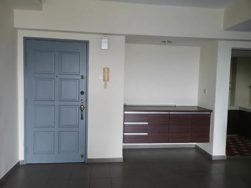 Room features: blue front door with panel design, wooden console table with drawers, light-colored walls, grey floor tiles, recessed ceiling lights, intercom system, wall-mounted light switch; style: modern.