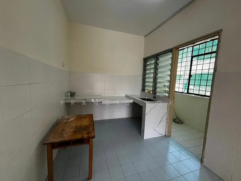 Kitchen features: white tiled walls, grey tiled flooring, single-bowl sink, chrome faucet, marble countertop, wooden table, sliding window, natural light from window.