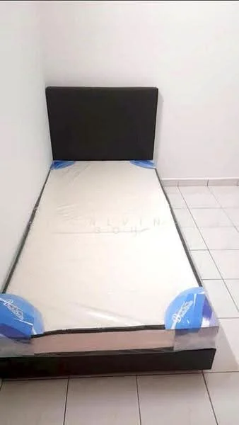 Bedroom features: single bed, black upholstered headboard, mattress with protective cover, white walls, tile flooring, neutral color scheme, minimal decor, no visible storage; style: minimalist.