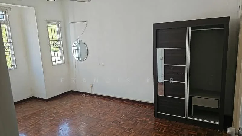Room features: wooden flooring, white painted walls, two small windows with metal grills, round mirror on the wall, built-in wardrobe with sliding doors, ceiling fan, corner space with no visible furniture; style: minimalist; view: garden.