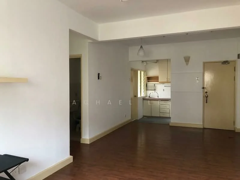 Room features: white painted walls, laminate flooring, kitchen area visible in background, pendant light fixture, door leading to another room, window with natural light, open layout, neutral color scheme; style: modern.