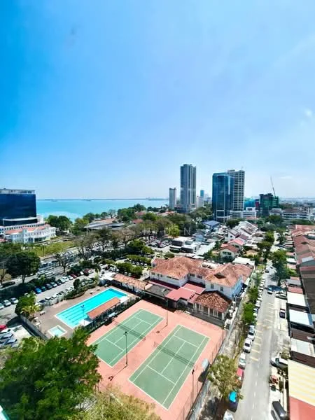 Exterior type: high-rise condominium; features: city skyline view, tennis courts, swimming pool, surrounding greenery, urban landscape, nearby residential buildings, parking lot, clear blue sky; style: modern.