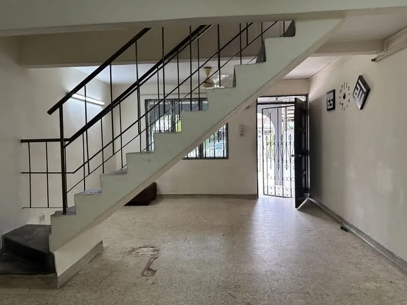 Room features: staircase with metal railing, white painted walls, light-colored flooring, large window, main entrance door, ceiling fan, decorative wall clock, open space layout; style: modern.