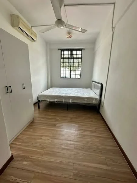 Bedroom features: single bed frame, mattress, wooden flooring, white painted walls, ceiling fan, window with grid, built-in wardrobe with two doors, air conditioning unit; style: minimalist.