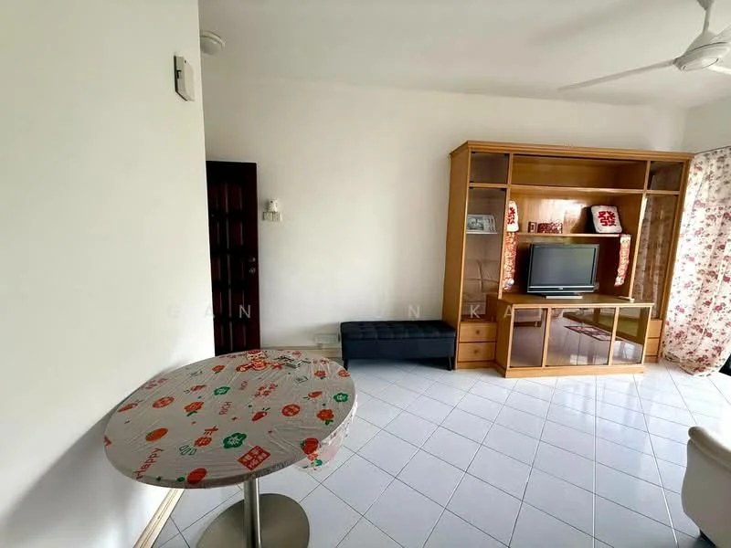 Living features: white painted walls, white tiled flooring, ceiling fan, wooden TV cabinet, wall-mounted TV, sofa, round dining table with decorative tablecloth, black ottoman, curtains with floral pattern; style: modern.