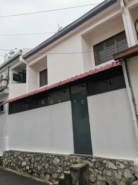 Exterior type: semi-detached house; features: white painted facade, red tiled roof, stone cladding at base, metal gate, window grilles, two-storey structure, surrounded by low wall; style: traditional.