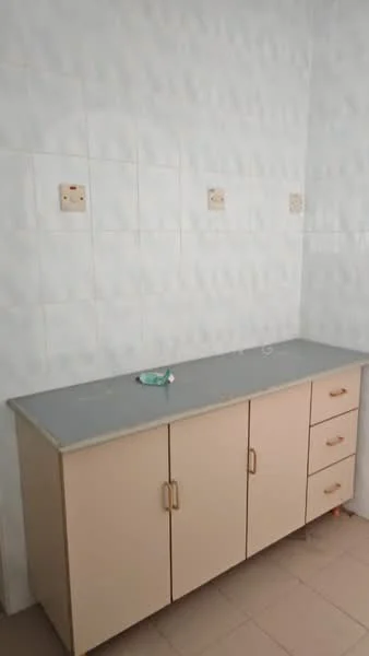 Room features: light grey countertop, cream cabinetry with handles, four cabinet doors, three drawers, white tiled walls, beige tiled flooring.