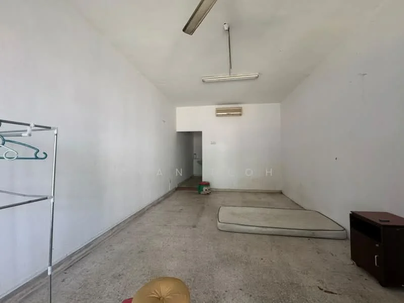 Room features: white painted walls, concrete flooring, 1 ceiling fan, 1 wall-mounted split AC, single mattress on the floor, wooden cabinet, clothes rack.