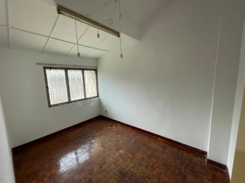 Room features: white painted walls, parquet wood flooring, sloped ceiling, window with security grille, ceiling light fixture.