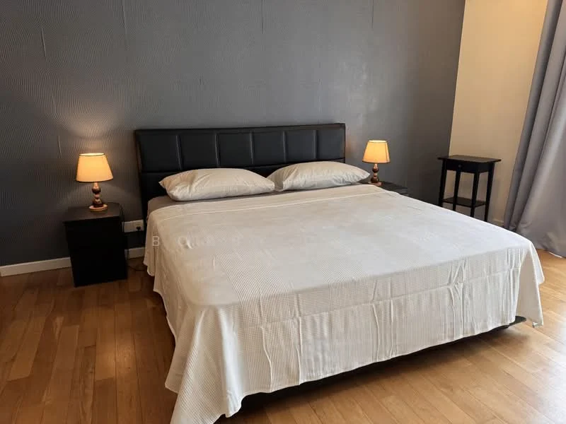 Bedroom features: king-size bed with upholstered headboard, white bedspread, two bedside lamps with warm light, dark wood nightstands, wooden flooring, grey accent wall, floor-to-ceiling curtains, decorative wall texture; style: modern.