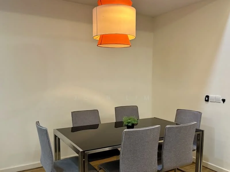 Dining features: black glass dining table, 6 upholstered dining chairs in grey, pendant lamp with orange shade, wooden flooring, decorative plant on table, white painted walls, wall-mounted electrical outlet; style: modern.