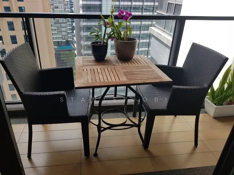 Balcony features: outdoor dining table, two wicker chairs, wooden tabletop, potted orchid plant, potted greenery, glass railing, tile flooring; style: modern; view: city.
