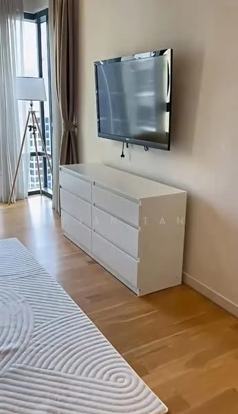 Room features: white dresser with six drawers, wall-mounted flat-screen TV, light wood flooring, floor-to-ceiling windows, sheer curtains, lamp on tripod stand, neutral wall color, decorative wall texture; style: modern; view: city.
