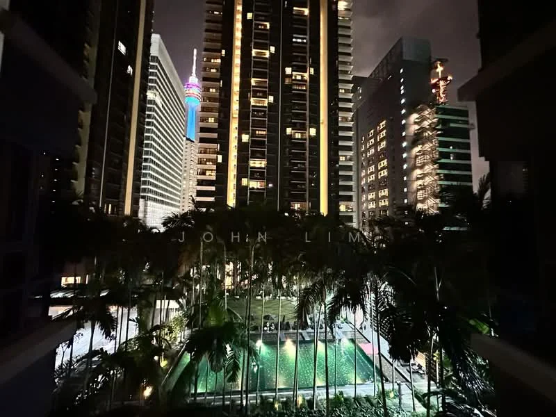 Exterior type: high-rise condominium; features: swimming pool, landscaped garden, tall palm trees, city skyline view, illuminated building facades, night lighting, surrounding high-rise buildings; style: modern.