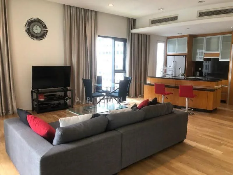 Living features: 3-seater grey fabric sofa, red and black accent cushions, glass coffee table, wall-mounted TV, TV console, wooden flooring, large windows with sheer curtains, clock on wall, area rug, dining table for four with black chairs, open kitchen layout with breakfast bar, kitchen cabinetry in wood finish, black countertop, stainless-steel appliances; style: modern; view: city.