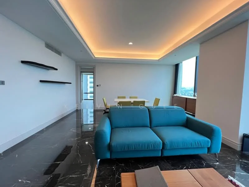 Living features: blue fabric sofa, marble flooring, recessed ceiling lights, crown moulding, wall-mounted shelves, large windows with city view, open layout, neutral painted walls, coffee table; style: modern; view: city.