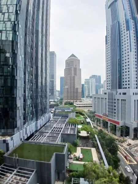 Exterior type: high-rise condominium; features: glass curtain wall facade, green rooftop terrace, landscaped garden area, surrounding high-rise buildings, city skyline view, solar panel installation, outdoor seating area, manicured lawn; style: modern.