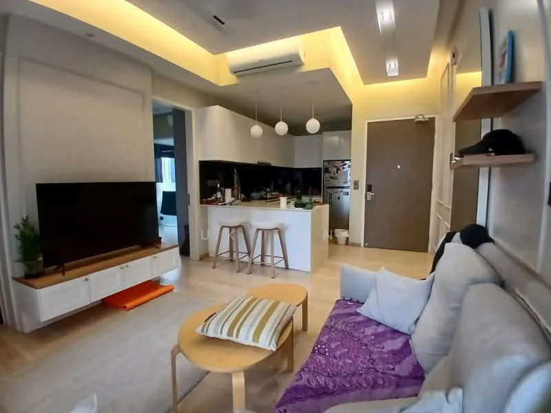 Living features: light grey fabric sofa, purple throw blanket, wooden coffee table, TV console with white cabinetry, wall-mounted TV, recessed ceiling lights, pendant lighting, laminate flooring, open-plan layout to kitchen, green plant on console, decorative wall shelf; style: modern. Kitchen features: white cabinetry, kitchen island with bar stools, stainless-steel fridge, built-in oven, 4-burner gas hob, exhaust hood, countertop with breakfast bar, open shelving, tile backsplash; style: modern.