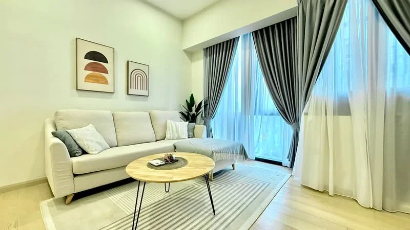Living features: 3-seater fabric sofa in light grey, round wooden coffee table, area rug with geometric pattern, floor-to-ceiling windows, sheer curtains, blackout curtains, framed artwork on walls, indoor plant, light wood flooring, wall-mounted decor; style: modern.