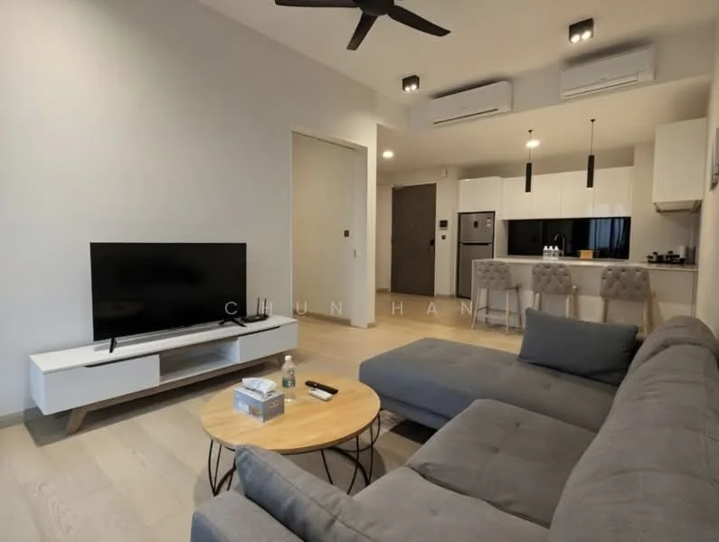 Living features: grey fabric sectional sofa, round wooden coffee table, wall-mounted flat-screen TV, light wood flooring, recessed LED downlights, 5-blade ceiling fan, air conditioning unit, open layout to kitchen, decorative wall art, neutral wall color; style: modern. Kitchen features: white cabinetry, stainless-steel refrigerator, built-in oven, 4-burner gas hob, black countertop, kitchen island with seating, sink with faucet, microwave, tile backsplash; style: modern.