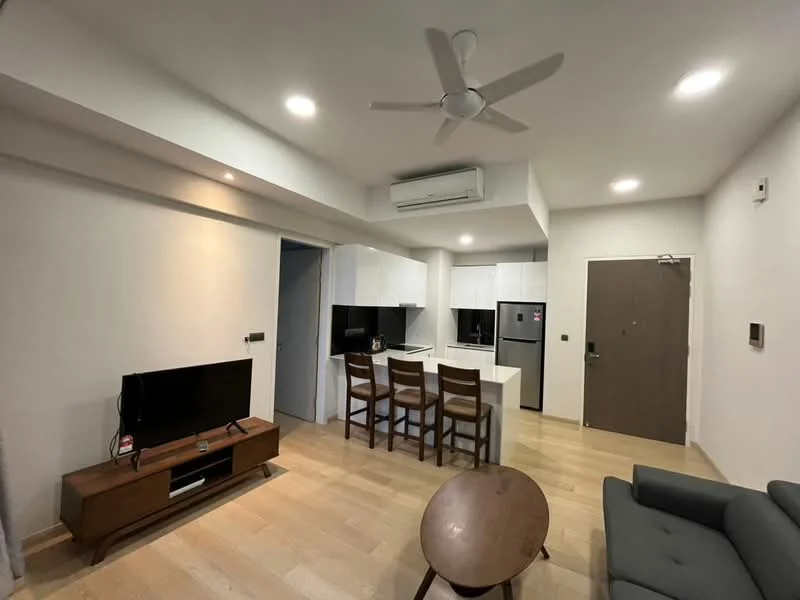 Living features: 5-blade ceiling fan with light, wall-mounted TV, wooden TV console, grey fabric sofa, round coffee table, light wood flooring, recessed downlights, air conditioning unit, open layout to kitchen, neutral painted walls; style: modern. Kitchen features: white cabinetry, black countertops, stainless-steel fridge, built-in oven, freestanding range oven, kitchen island with seating, recessed downlights; style: modern.