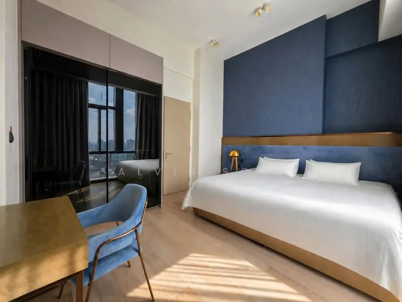 Bedroom features: king-size bed with white bedding, upholstered headboard in blue, wooden bedside table with lamp, built-in wardrobe with mirrored doors, large window with city view, curtains in dark fabric, wooden flooring, desk with blue upholstered chair, recessed ceiling lights; style: modern; view: city.