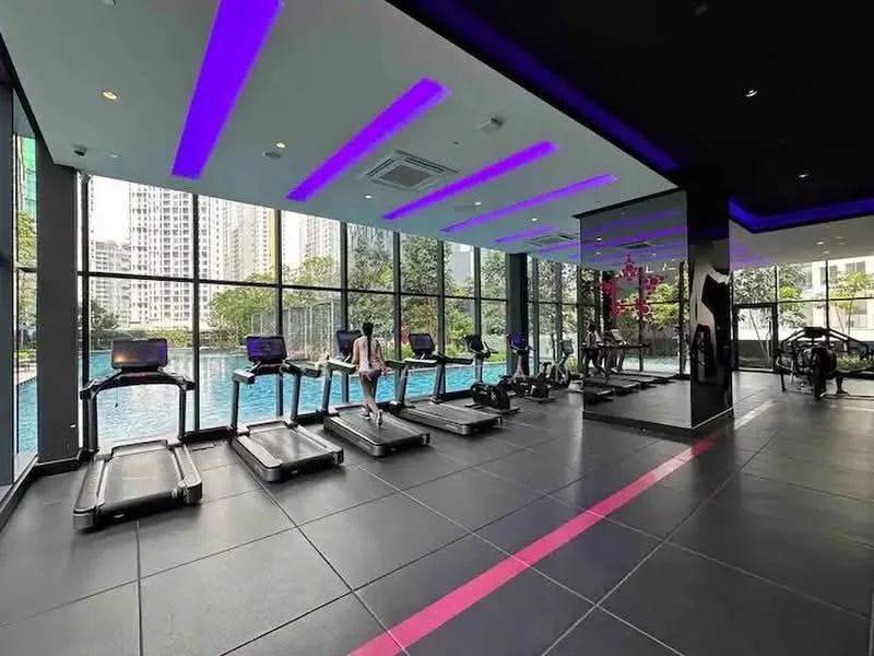Room features: treadmills, large floor-to-ceiling windows, view of swimming pool, black tile flooring, purple LED strip lighting, air conditioning unit, mirrored wall, exercise bikes; style: modern; view: pool.