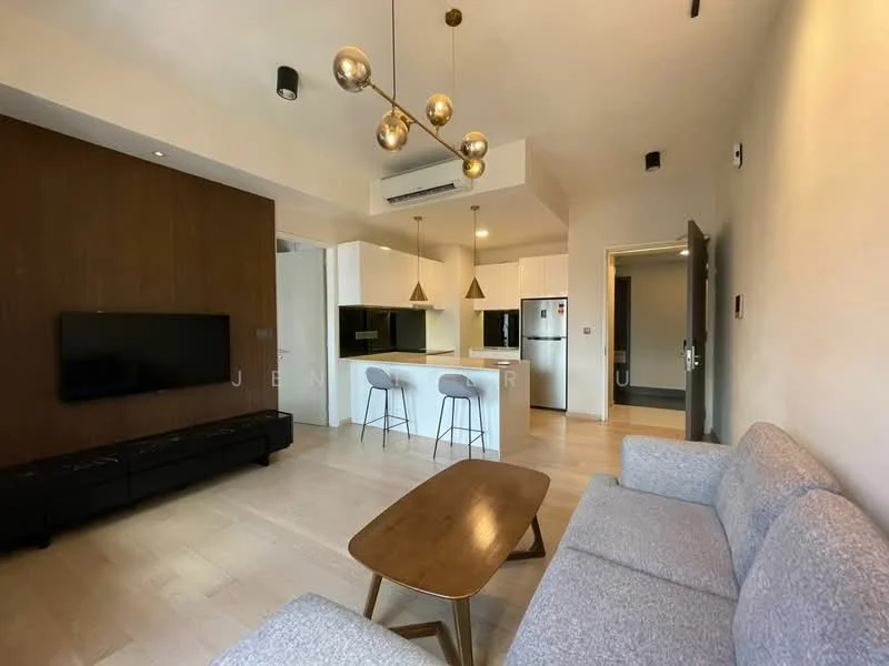 Living features: light wood flooring, white painted walls, wood accent wall, sofa in light grey fabric, coffee table in wood, wall-mounted TV, recessed downlights, 5-blade ceiling fan, open-plan layout with kitchen, kitchen island with seating, stainless-steel fridge, built-in oven, microwave; style: modern.