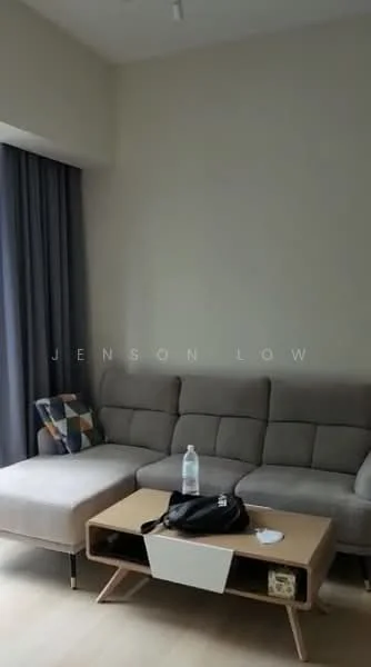 Living features: L-shape sectional sofa in grey, coffee table with storage, decorative throw pillow with geometric pattern, floor-to-ceiling windows with sheer curtains, light wood flooring, neutral painted walls, recessed ceiling lights; style: modern.
