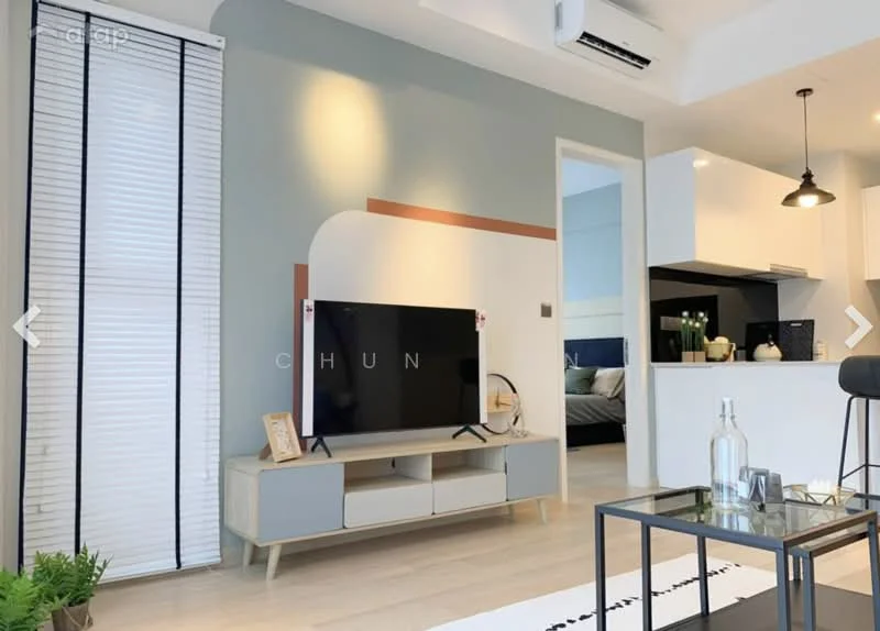 Living features: light wood flooring, green accent wall, white painted walls, wall-mounted TV, TV console with storage, black coffee table, air conditioning unit, recessed ceiling lights, sliding window blinds, decorative wall art, open-plan layout to kitchen, sofa, decorative plants; style: modern.
