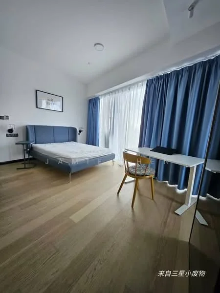 Bedroom features: queen-size bed with upholstered headboard, wooden flooring, floor-to-ceiling windows with sheer curtains, blue curtains, study desk with white surface, wooden chair, wall-mounted bedside lamps, framed artwork on wall, built-in wardrobe, recessed ceiling lights; style: modern.