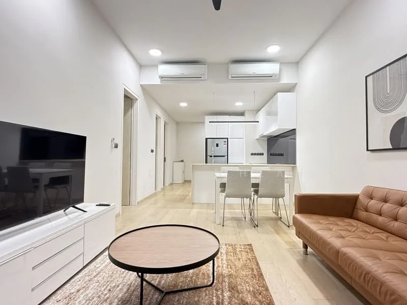 Living features: 3-seater leather sofa in brown, round coffee table with wooden top, area rug with geometric pattern, wall-mounted TV, TV console in white, 2 wall-mounted split AC units, recessed LED downlights, light wood flooring, white painted walls, decorative wall art; style: modern. Kitchen features: white cabinetry, stainless-steel appliances, built-in oven, 4-burner gas hob, exhaust hood, kitchen island with seating, white quartz countertop, backsplash with white tiles; style: modern.