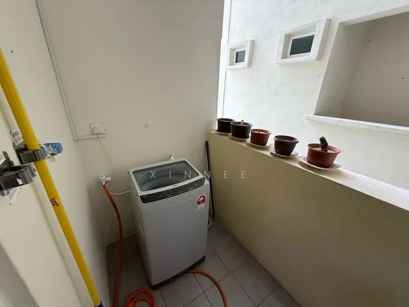 Laundry features: top-load washing machine, grey tiled flooring, white painted walls, small windows, potted plants on ledge, water hose, electrical outlet, drainage pipe.