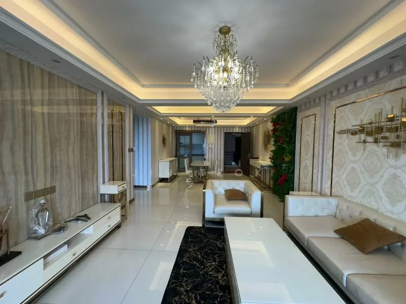 Living features: chandelier, recessed downlights, white painted walls, decorative wall panels, marble tile flooring, cream leather sofa, glass coffee table, black area rug with gold pattern, TV console with drawers, greenery wall decor, air conditioning unit, sliding glass door, curtains, wall-mounted artwork; style: modern.