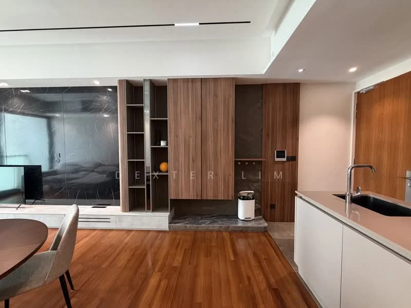 Living features: wooden flooring, white painted walls, built-in cabinetry with wood finish, black stone accent wall, recessed lighting, open-plan layout, round dining table, upholstered dining chairs, kitchen island with sink, countertop with smooth surface, visible waste bin; style: modern.