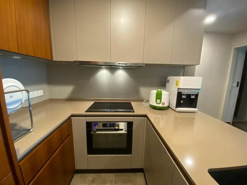 Kitchen features: brown wooden cabinetry, grey laminate countertop, built-in oven, induction cooktop, stainless-steel sink, chrome faucet, white countertop appliances, under-cabinet lighting, tile flooring; style: modern.