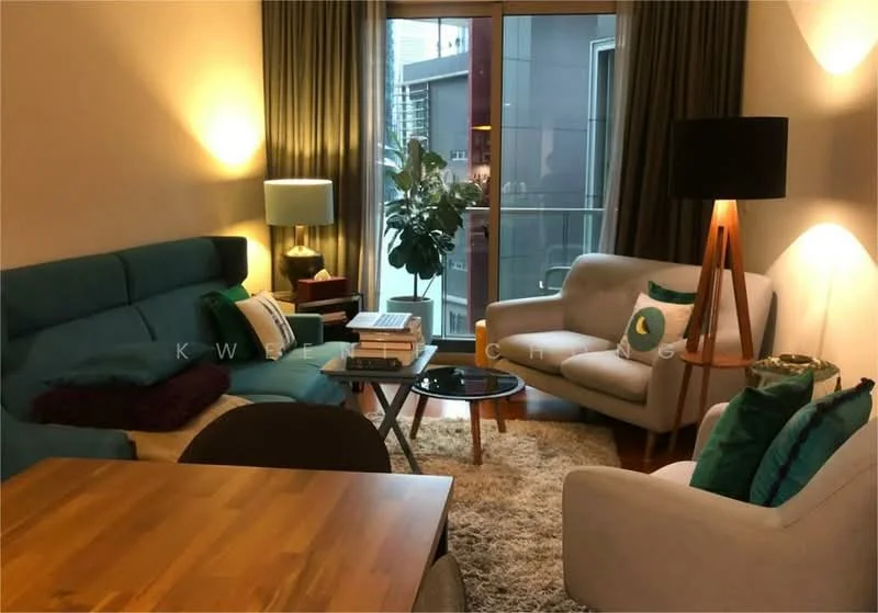 Living features: teal fabric sofa, white armchair, wooden coffee table, area rug, floor lamp with wooden base, green decorative cushions, potted plant, curtains, large window with outdoor view, laptop on coffee table; style: modern; view: city.