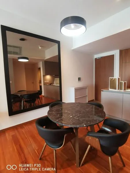 Dining features: round marble dining table, 4 black upholstered dining chairs, large wall mirror, wooden flooring, recessed ceiling lights, wall-mounted air conditioning unit, built-in cabinetry, neutral wall color; style: modern.