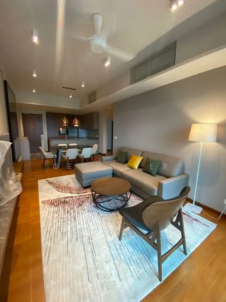 Living features: 3-seater fabric sofa in grey, accent cushions in yellow and green, coffee table with circular design, area rug with abstract pattern, wooden flooring, 5-blade ceiling fan with light, wall-mounted TV, floor lamp, dining area visible in background, pendant lights above dining table; style: modern.