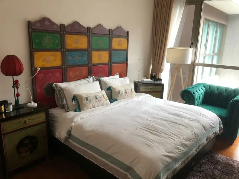Bedroom features: king-size bed with white bedding, colorful headboard with decorative panels, green velvet armchair, wooden bedside tables, table lamp with red shade, floor lamp, curtains, wooden flooring, decorative pillows with patterns; style: modern.