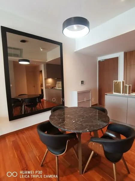 Dining features: round marble dining table, 4 black upholstered dining chairs with wooden legs, large wall mirror, wooden flooring, recessed ceiling lights, wall-mounted cabinet, neutral wall color, open layout; style: modern.