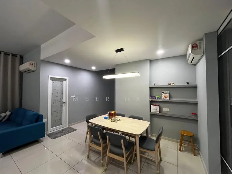 Dining features: rectangular dining table, 6 wooden dining chairs, pendant light fixture, grey painted walls, white ceiling, 2 wall-mounted split AC units, open shelving unit, floor tiles, door leading to hallway, decorative items on shelf; style: modern. Living features: 3-seater fabric sofa in blue, grey curtains, wall-mounted shelf, floor tiles, decorative items on shelf; style: modern.