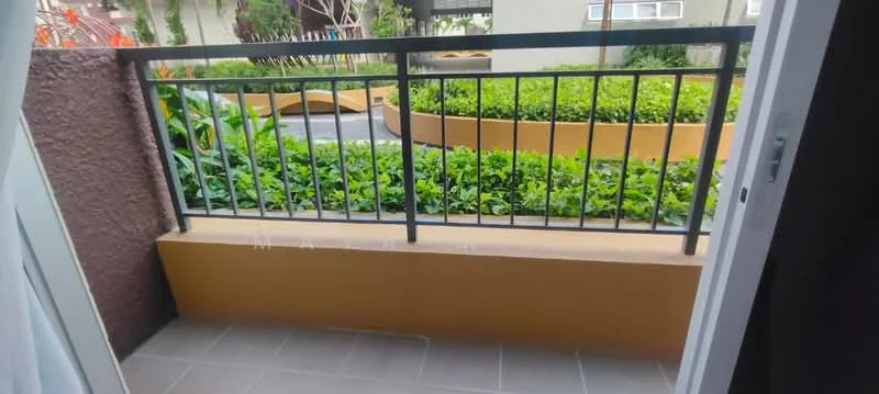 Balcony features: metal railing, tiled flooring, greenery view, planter box with plants, concrete wall, decorative landscaping; view: garden.