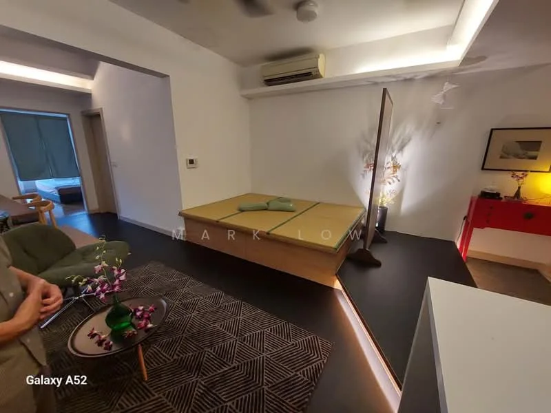 Room features: tatami mat flooring, recessed ceiling lights, wall-mounted split AC, floor-to-ceiling window, green curtains, wooden platform bed, decorative mirror, red side table, area rug with geometric pattern, green armchair, decorative plant, wall art; style: modern.