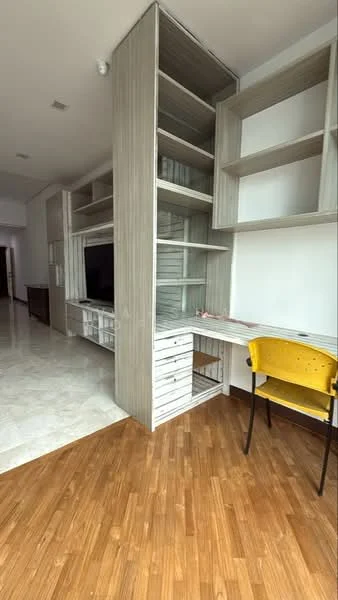 Room features: built-in shelving unit with multiple compartments, white wooden cabinetry, desk area with drawers, yellow chair, marble tile flooring, wooden flooring, wall-mounted TV console, open shelving, neutral wall color, recessed lighting; style: modern.