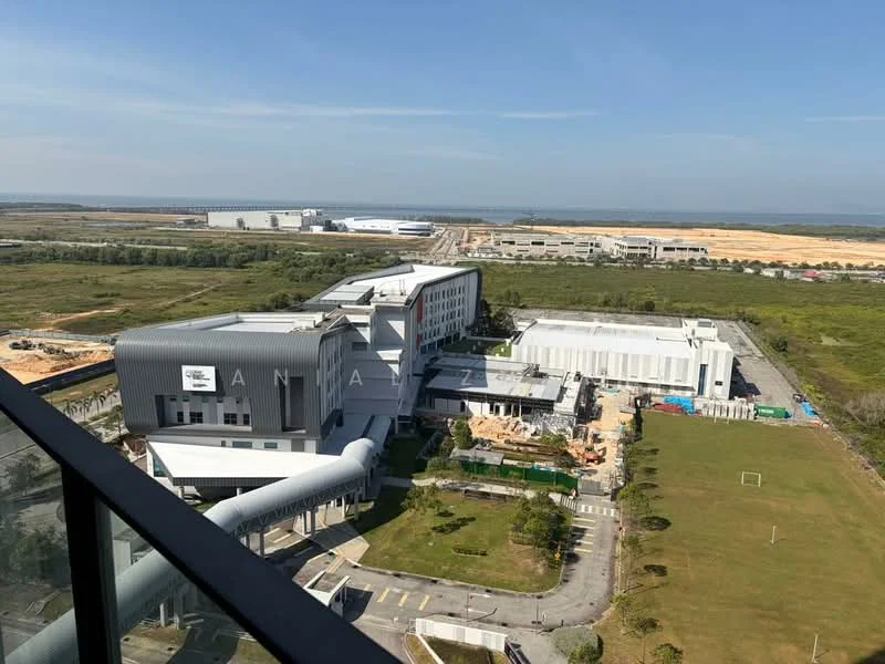 Exterior features: modern architectural design, multiple levels, large glass windows, metal cladding, surrounding greenery, open field, construction site in the background, clear blue sky; style: modern.