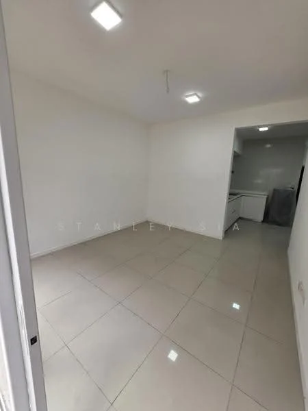 Room features: white painted walls, glossy ceramic tile flooring, recessed LED downlights, single ceiling light fixture, open layout, no visible furniture, neutral color scheme, kitchen area visible in background; style: modern.
